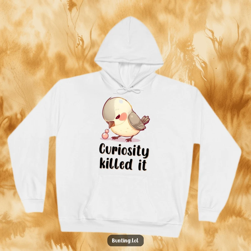 Funny hoodie featuring a curious bird focused on pecking a small, shiny bead, showcasing a humorous and relatable obsession.