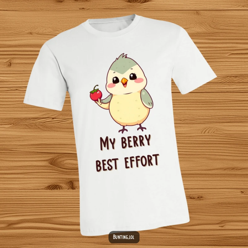 Funny Proud Bunting T-Shirt showing a cute bunting bird proudly holding a tiny berry, perfect for a funny gift for achievers.